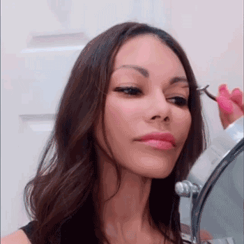 Using an eyelash applicator or carefully with tweezers, while final coat of eyeliner is tacky, place each eyelash on top of the magnetic liner (not too close to the inner eye).  The lashes will softly click onto the liner.