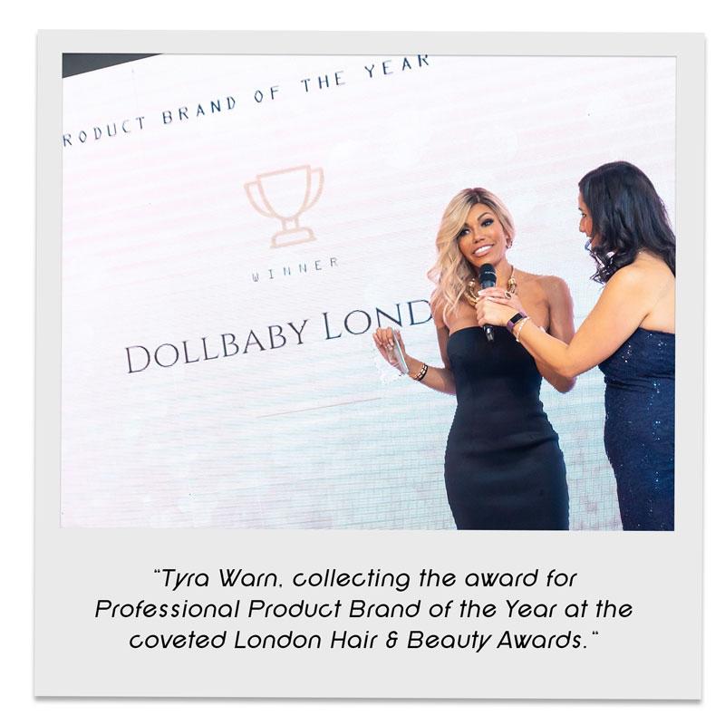 Tyra Warn collecting Dollbaby London Award Professional Product Brand of the Year at the coveted London Hair & Beauty Awards